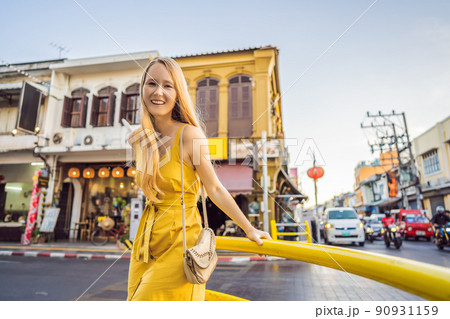 Woman tourist on the Street in the Portugese style Romani in Phuket Town. Also called Chinatown or the old town Woman tourist on the Street in the Portugese style Romani in Phuket Town. Also called Chinatown or the old town 90931159