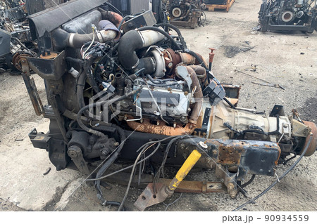Closeup of truck engine for recycling, motor of crashed automobile in junkyard, spare part for truck lorries. 90934559