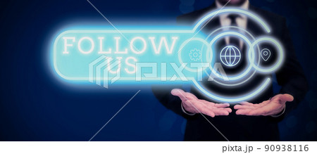 Hand writing sign Follow Us. Business approach To invite a person or group to join his company and take rules Businessman in suit holding open palm symbolizing successful teamwork. Hand writing sign Follow Us. Business approach To invite a person or group to join his company and take rules Businessman in suit holding open palm symbolizing successful teamwork. 90938116