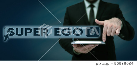 Conceptual caption Super Ego. Business approach The I or self of any person that is empowering his whole soul Lady in suit holding pen symbolizing successful teamwork accomplishments. Conceptual caption Super Ego. Business approach The I or self of any person that is empowering his whole soul Lady in suit holding pen symbolizing successful teamwork accomplishments. 90939034