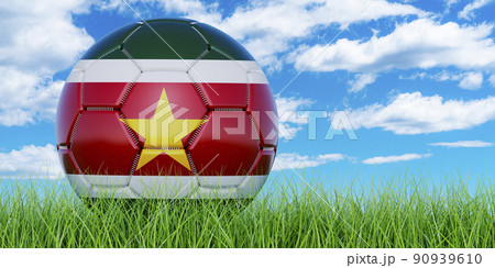Soccer ball with Surinamese flag on the green grass against blue sky, 3D rendering 90939610