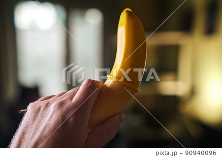 Condom and yellow banana Condom and yellow banana 90940096