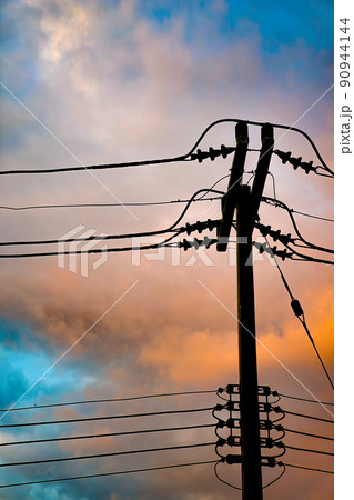 Electricity pole was standed alone in the beautiful Twilight time in Thailand. Electricity pole was standed alone in the beautiful Twilight time in Thailand. 90944144
