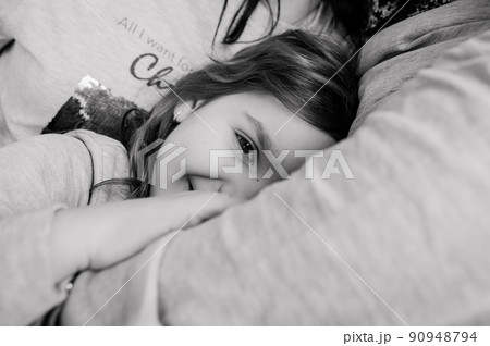 happy girl lies pillow sleep closed eyes 90948794