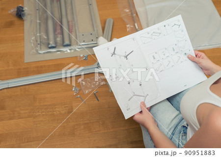 Instruction for furniture assembling in the female hands for self assembly. Instruction for furniture assembling in the female hands for self assembly. 90951883