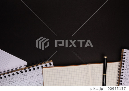 Paper notebook on black background texture. Creative idea concept 90955157