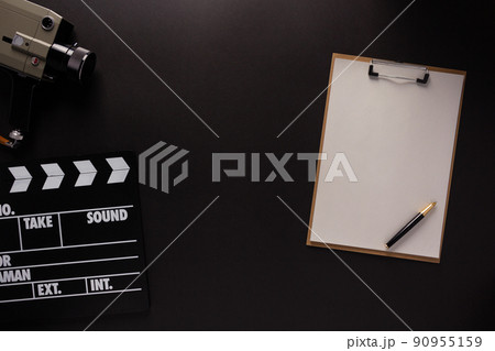 Clapboard and paper on black background texture. Movie idea concept 90955159