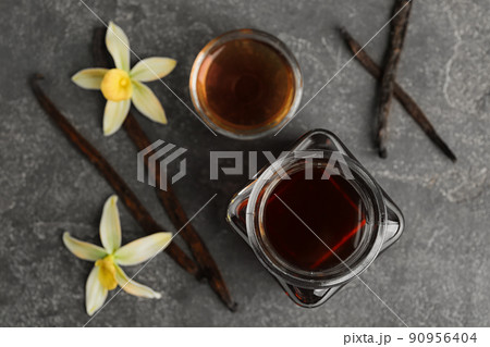 Flat lay composition with vanilla extract on grey table 90956404