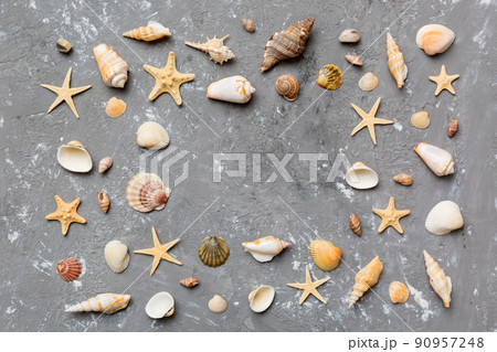 Summer time concept Flat lay composition with beautiful starfish and sea shells on colored table, top view with copy space for text 90957248