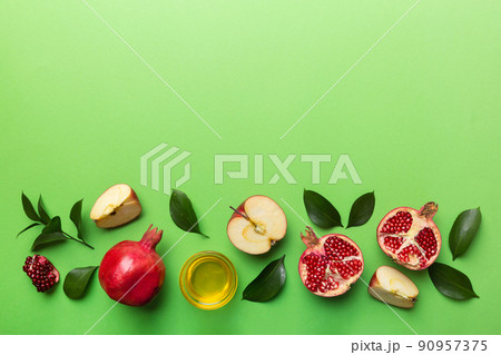 Flat lay composition with symbols jewish Rosh Hashanah holiday attributes on colored background, Rosh hashanah concept. New Year holiday Traditional. Top view with copy space Flat lay composition with symbols jewish Rosh Hashanah holiday attributes on colored background, Rosh hashanah concept. New Year holiday Traditional. Top view with copy space 90957375