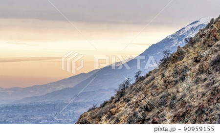 Pano Mountain in Provo Canyon Utah with stunning backdrop of sunset and cloudy sky 90959155