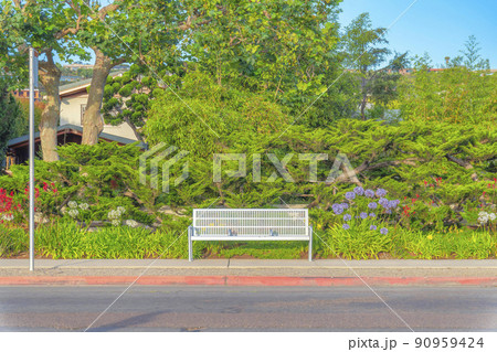 Outdoor bench on the side walk at La Jolla, San Diego, California Outdoor bench on the side walk at La Jolla, San Diego, California 90959424