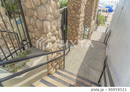 Stairs outside the fence and wall of the buildings at Carlsbad, San Diego, California 90959521