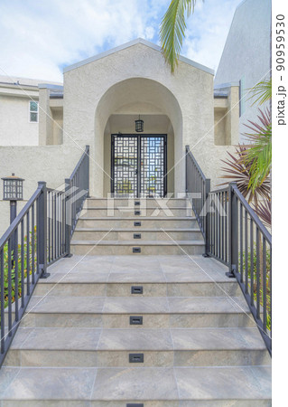 Marble tiles on a stairs with railings at Carlsbad, San Diego, California Marble tiles on a stairs with railings at Carlsbad, San Diego, California 90959530