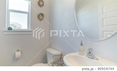 Pano Interior of a white bathroom with windows, mirror, sink and cabinet Pano Interior of a white bathroom with windows, mirror, sink and cabinet 90959744