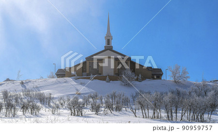Pano Exterior of a church on a mountain top covered with snow. Pano Exterior of a church on a mountain top covered with snow. 90959757