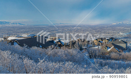 Panorama Whispy white clouds High angle view of Draper residential area in Utah 90959801