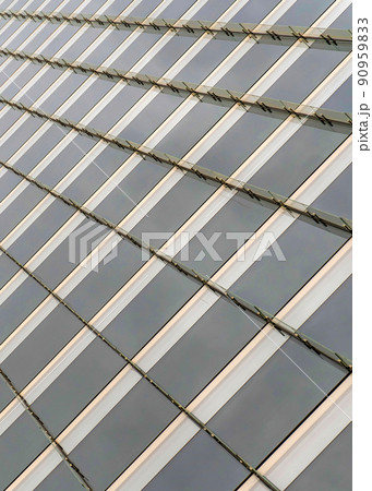 Vertical Tinted glass curtain wall of a building with vertical glass beams at Salt Lake City, Utah Vertical Tinted glass curtain wall of a building with vertical glass beams at Salt Lake City, Utah 90959833