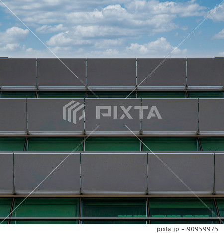 Square White puffy clouds Facade of a building with white sunshade panels at Salt Lake Cit 90959975