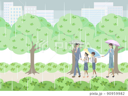 雨の日に街を背景にした緑の道を歩く男女と小学生 90959982
