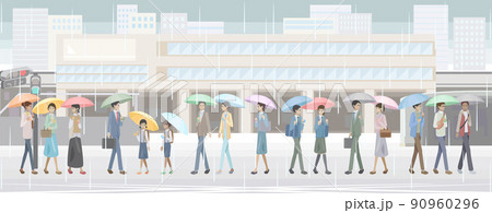 雨の日に傘をさして駅前を歩く学生と社会人 90960296