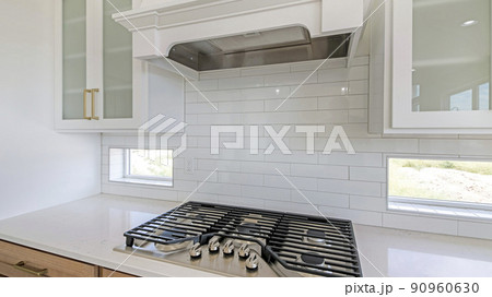Pano White kitchen counter with built-in gas cooktop with griddle in stainless steel Pano White kitchen counter with built-in gas cooktop with griddle in stainless steel 90960630