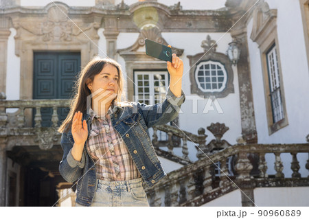 Woman with phone at Mateus Palace, Portugal 90960889