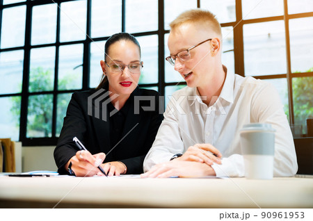Businessman and businesswoman meeting at office 90961953