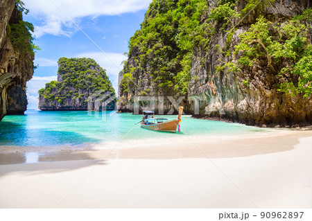 Thai traditional wooden longtail boat and beautiful beach in Phuket province, Thailand. Thai traditional wooden longtail boat and beautiful beach in Phuket province, Thailand. 90962897