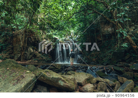 Waterfall in the tropical forest in the rainy season 90964556