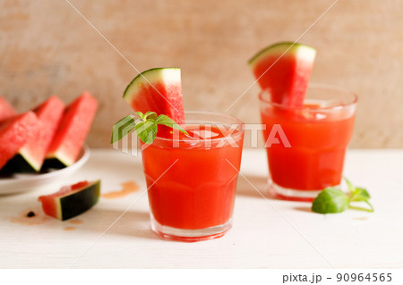 Fresh watermelon juice with ice in a glass. Fresh watermelon juice with ice in a glass. 90964565