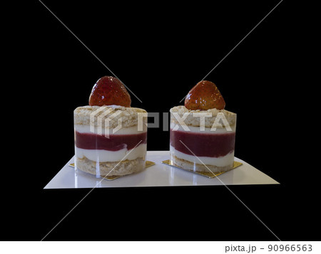 Double strawberry fondant or cheesecake isolated on black background 90966563