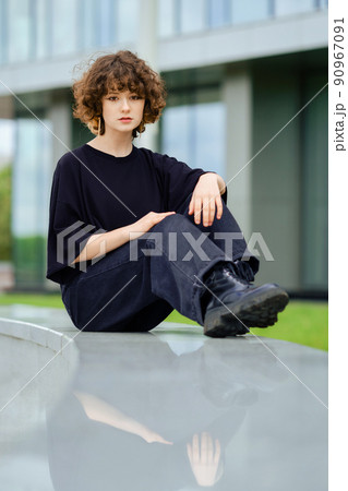Girl in total black outfit outdoors 90967091