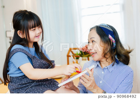 Asian portrait, grandchild granddaughter grandma grandmother and granddaughter happily join in activities to enhance skills for grandchildren. Asian portrait, grandchild granddaughter grandma grandmother and granddaughter happily join in activities to enhance skills for grandchildren. 90968492