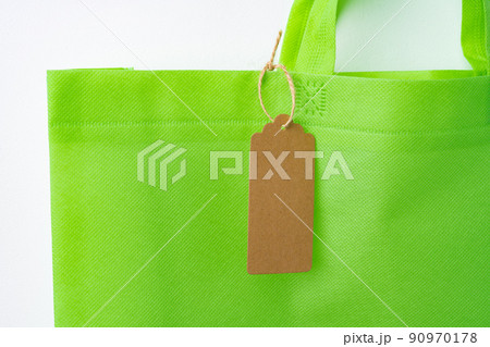Blank paper tag with shopper paperbag on white background Blank paper tag with shopper paperbag on white background 90970178