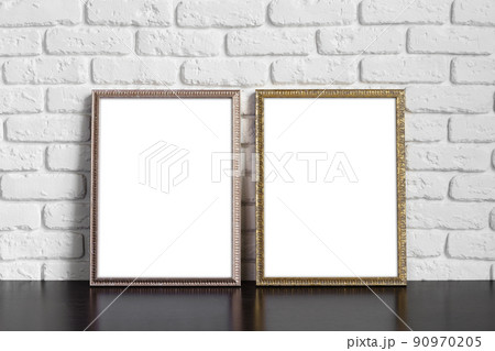 Blank picture frame against brick wall with copy space Blank picture frame against brick wall with copy space 90970205