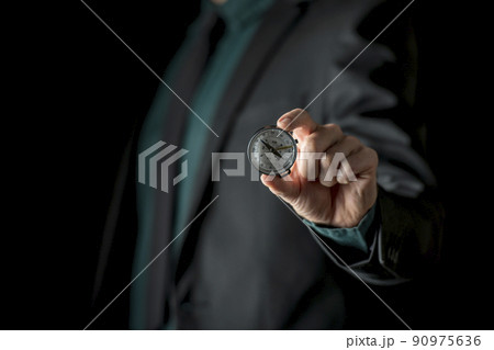 Hand showing compass 90975636