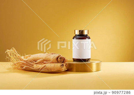 A front view of ginseng decorated in wooden dish in yellow background  90977286