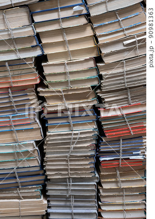 Stack of books in library. Book texture. Different vintage books in row. Stack of books in library. Book texture. Different vintage books in row. 90981363