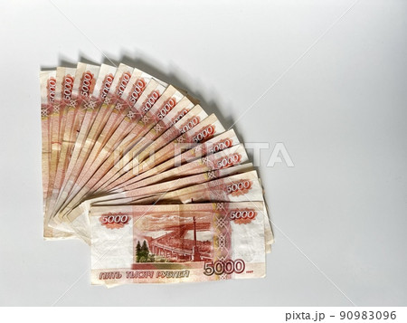 Fan of five thousand roubles banknotes. Russian currency on white background Fan of five thousand roubles banknotes. Russian currency on white background 90983096