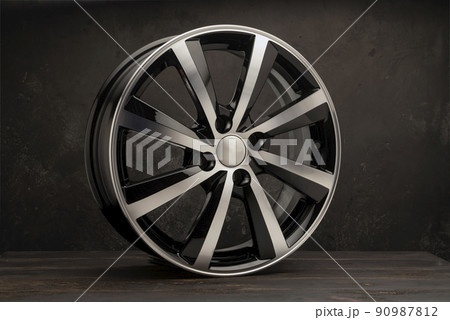 new black alloy wheels on a dark textured black background. wheel for car spare parts auto repair tire shop, new black alloy wheels on a dark textured black background. wheel for car spare parts auto repair tire shop, 90987812