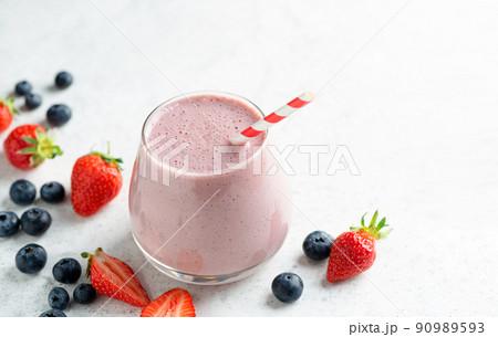 Strawberry blueberry smoothie or milkshake 90989593