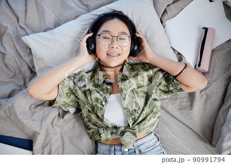 Teen Girl Listening to Music Teen Girl Listening to Music 90991794