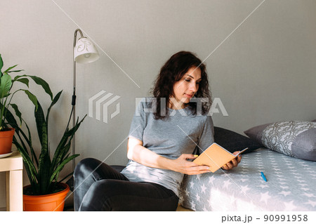 Woman working from home studying. Advanced training, retraining profession. Woman working from home studying. Advanced training, retraining profession. 90991958