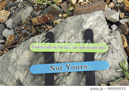Motivational and inspirational quote written on a colorful wooden stick. 90993033