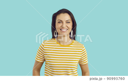 Portrait of happy young woman in casual wear posing Portrait of happy young woman in casual wear posing 90993760