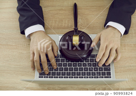 Lawyer using laptop, providing virtual law consultation and giving legal advice online Lawyer using laptop, providing virtual law consultation and giving legal advice online 90993824