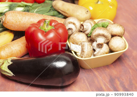 Vegetables and mushrooms on wooden table. Vegetables and mushrooms on wooden table. 90993840