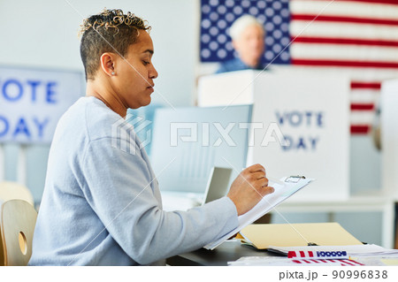Black Woman with Voting Ballot 90996838
