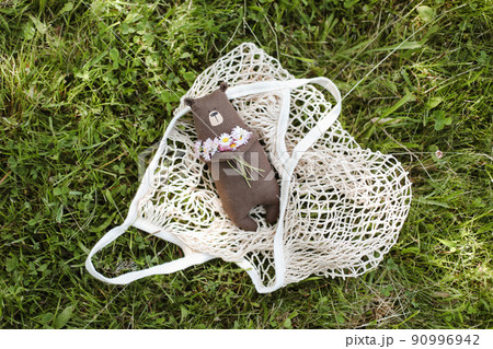 Eco-friendly cute handmade toy bear on grass at sunny summer day. Eco-friendly cute handmade toy bear on grass at sunny summer day. 90996942